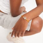 Orange cord bracelet with a pearl